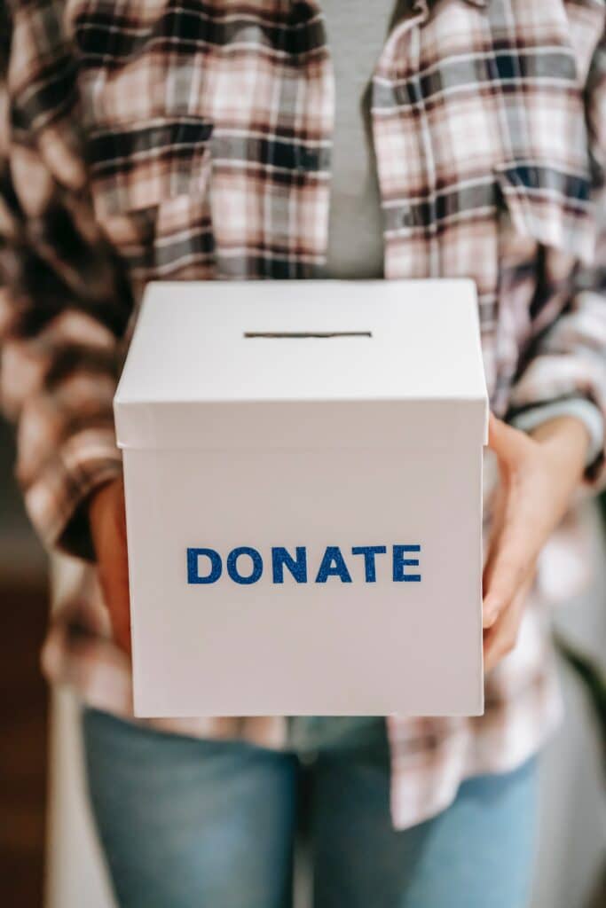 fundraising - Photo by Liza Summer: https://www.pexels.com/photo/crop-anonymous-person-showing-donation-box-6348119/