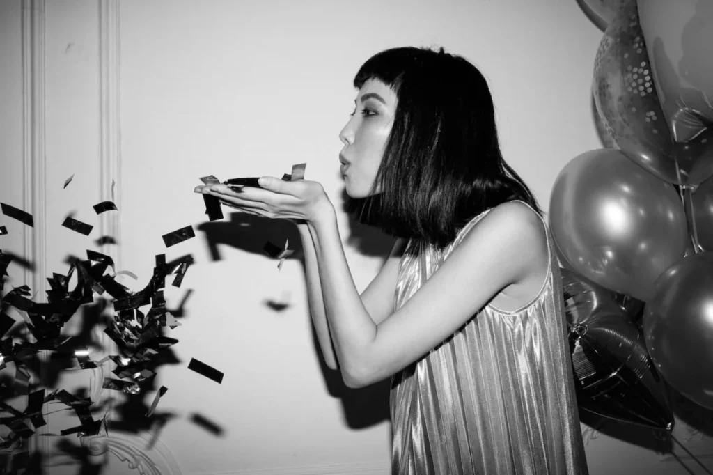 Photo by cottonbro studio: https://www.pexels.com/photo/woman-with-confetti-on-her-hands-3419700/ - office party