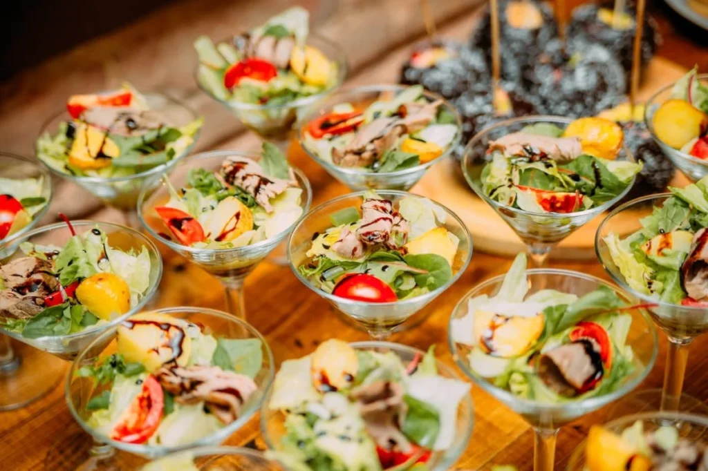Photo by Kseniia Lopyreva: https://www.pexels.com/photo/delicious-appetizers-in-glass-dishes-on-banquet-table-4959898/ -- catering