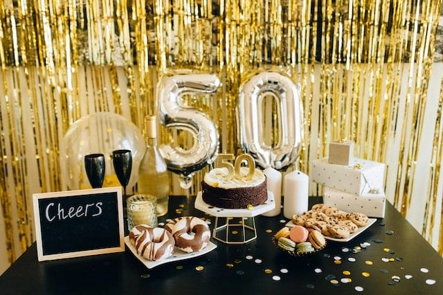 Photo by Nataliya Vaitkevich: https://www.pexels.com/photo/donuts-and-chocolate-chip-cookies-on-white-ceramic-plates-7859956/ - birthday