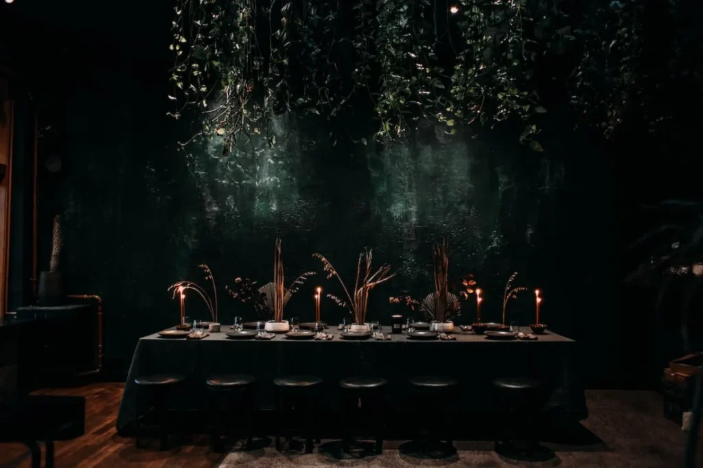 Photo by Rachel Claire: https://www.pexels.com/photo/row-of-stools-next-to-long-table-covered-with-tablecloth-in-dark-hall-4577179/ - holiday party