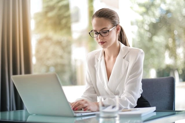 Photo by Andrea Piacquadio: https://www.pexels.com/photo/concentrated-female-entrepreneur-typing-on-laptop-in-workplace-3756681/ -- corporate
