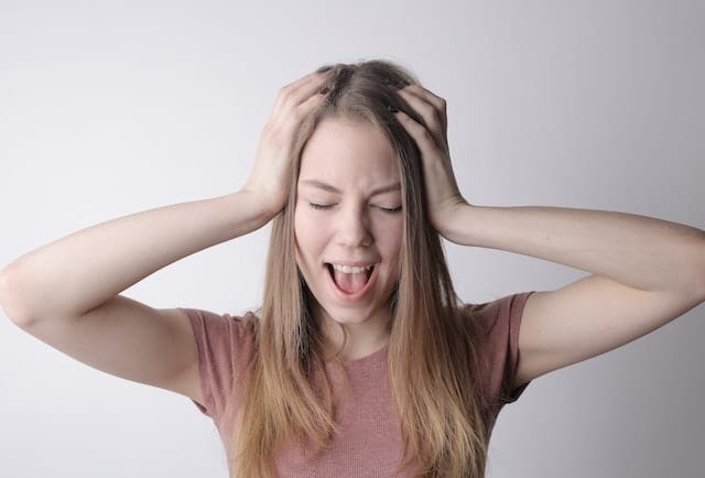 Photo by Andrea Piacquadio: https://www.pexels.com/photo/young-frustrated-woman-screaming-with-closed-eyes-3885618/ - mistake