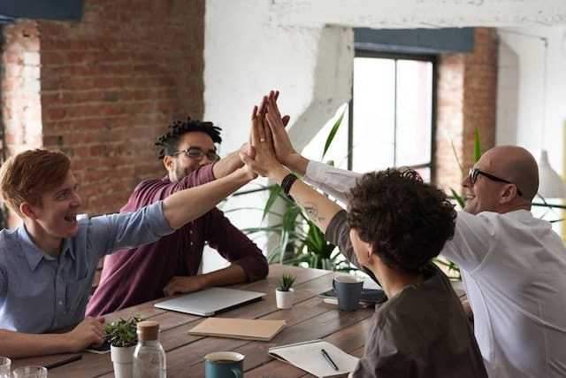 Photo by fauxels: https://www.pexels.com/photo/photo-of-people-holding-each-other-s-hands-3184422/ -- team-building
