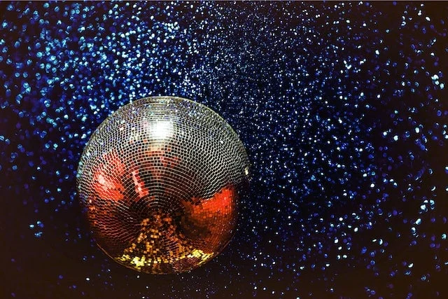 Photo by NEOSiAM 2021: https://www.pexels.com/photo/silver-disco-ball-593467/ -- dazzle event