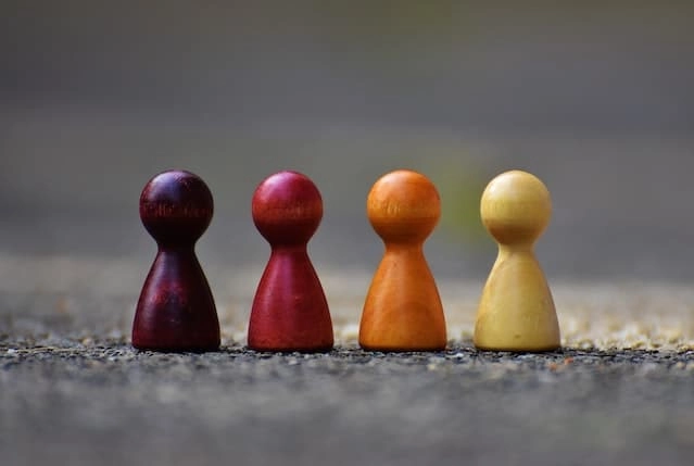 Photo by Pixabay: https://www.pexels.com/photo/focus-photo-of-4-wooden-pawn-figurine-209728/ -- team-building