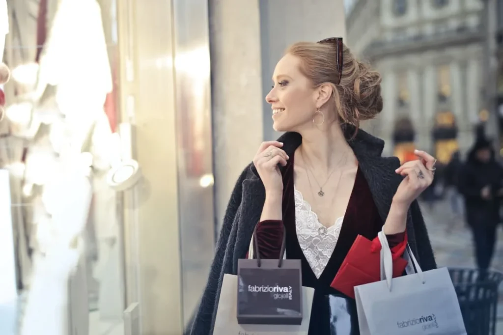 Photo by Andrea Piacquadio: https://www.pexels.com/photo/woman-wearing-black-blazer-holding-shopping-bags-974964/ -- customer