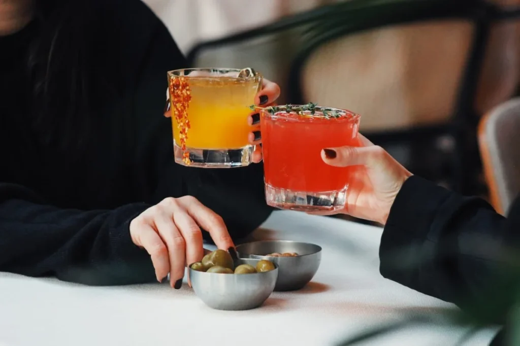 Photo by Doğu Tuncer: https://www.pexels.com/photo/toast-with-cocktails-15880732/ -- cocktail party