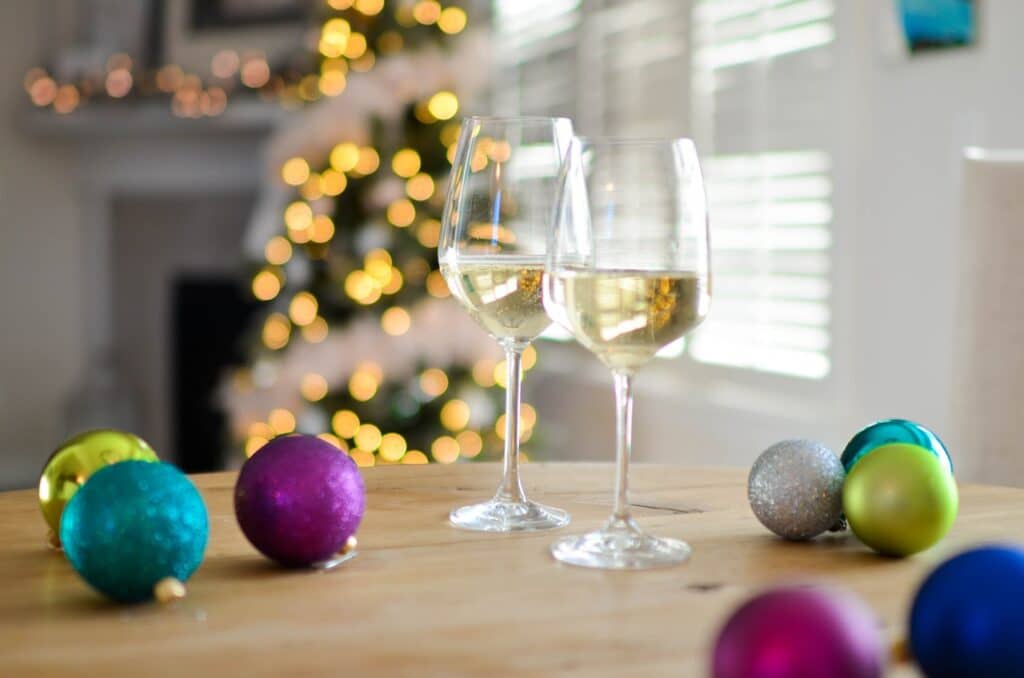 Photo by Element5 Digital: https://www.pexels.com/photo/two-champagne-glasses-near-baubles-712324/ -- holiday party