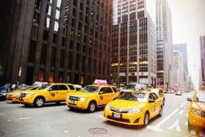 Image Title: NYC’s Iconic Mobile Billboards Image Description: Yellow cabs showcasing urban advertisements in NYC Alt Text: NYC Taxi Ads Source: https://www.pexels.com/photo/yellow-vehicles-at-the-street-8247/