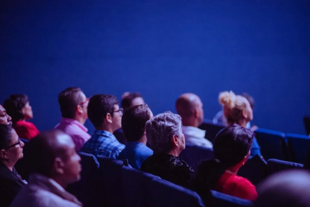 Image Title: Engrossed New York Audience Image Description: Attentive audience at an NYC brand launch event. Alt Text: Brand Launches Source: https://www.pexels.com/photo/people-sitting-on-gang-chairs-2774556/