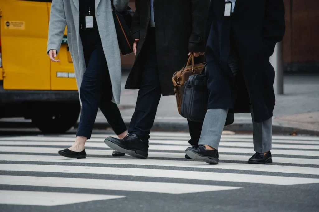 Photo by Sora Shimazaki: https://www.pexels.com/photo/crop-faceless-colleagues-walking-on-crossroad-in-city-5669627/ -- corporate