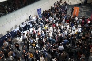  Image Title: Busy Expo Floor Image Description: A crowded event hall with attendees networking around exhibitor booths Alt Text: Numerous attendees mingling and visiting stands in a spacious convention center Source: https://unsplash.com/photos/nOvIa_x_tfo