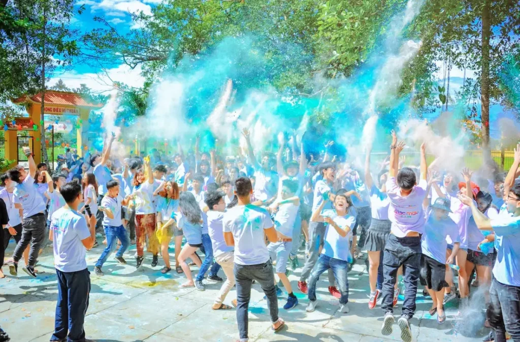 Photo by Min An: https://www.pexels.com/photo/people-throwing-blue-powder-at-daytime-1157557/ -- experiential event