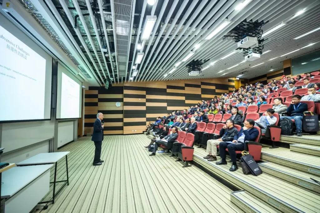 Image Title: Insights in Action: Event Industry Leaders Image Description: A presenter engages an audience of professionals at an event planning conference Alt Text: Conference Presentation Source: https://www.pexels.com/photo/man-standing-in-front-of-people-sitting-on-red-chairs-1708936/