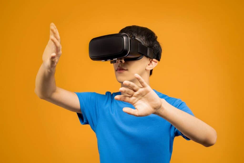 Image Title: Navigating Virtual Spaces Image Description: A person explores a digital landscape using VR technology. Alt Text: VR Interaction Source: https://www.pexels.com/photo/man-in-blue-crew-neck-t-shirt-wearing-black-vr-goggles-3761111/