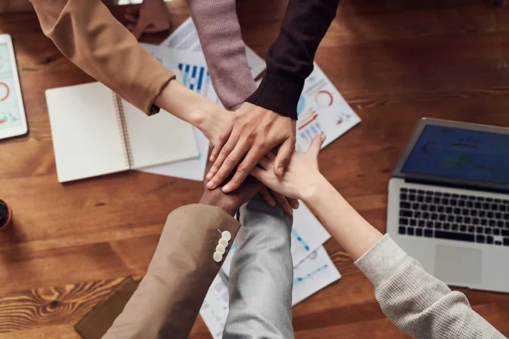 Boost camaraderie and morale across remote and in-office team members with unique virtual team-building events. -- team hands