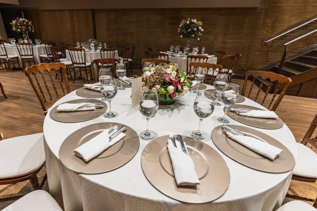 Photo by Matheus Bertelli: https://www.pexels.com/photo/elegant-tableware-for-wedding-reception-in-restaurant-17001777/ -- event venue table