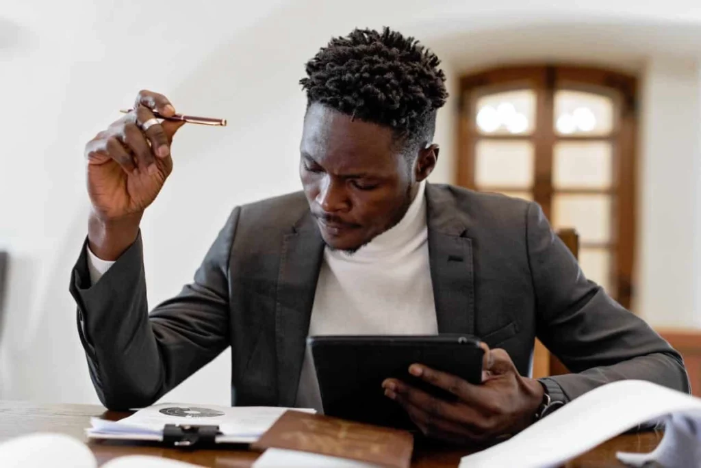 Photo by Mikhail Nilov from Pexels: https://www.pexels.com/photo/focused-man-working-in-office-8729946/ -- event planner