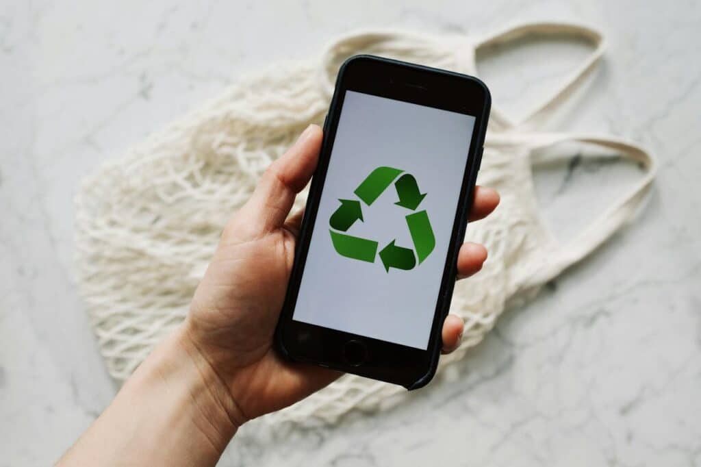 Source: Photo by ready made: https://www.pexels.com/photo/person-holding-an-iphone-3850587/ Title: Corporate Event Planning Alt. Title: Sustainable Event Planning