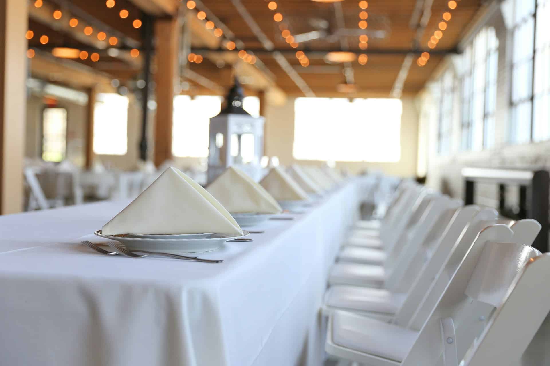 Image title: Image of an empty hall for a pop-up event. Image alt-title: pop-up event planning Image URL: https://unsplash.com/photos/table-napkin-lot-xXaLfz6V9rQ 