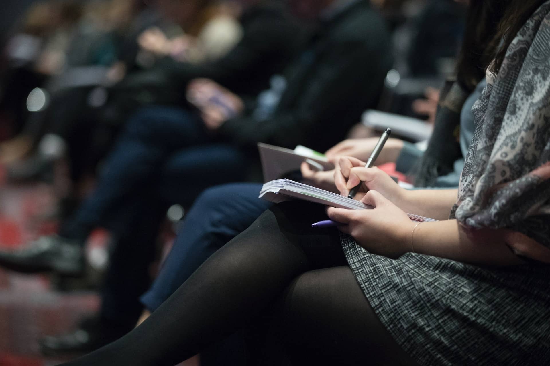 Image Title: NYC Tech Conferences 2024 Image Description: A conference Alt Text: Leadership Conferences New York 2024 Source: https://unsplash.com/photos/selective-focus-photography-of-people-sitting-on-chairs-while-writing-on-notebooks-Hb6uWq0i4MI