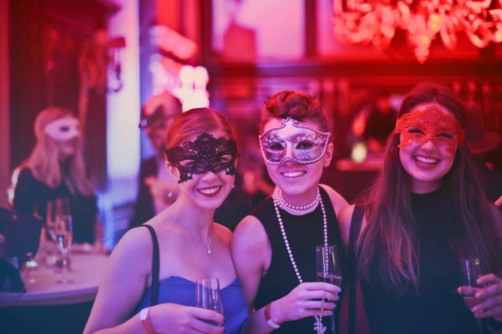 Photo by Andrea Piacquadio: https://www.pexels.com/photo/photo-of-women-wearing-masks-787961/ -- masquerade party, milestone birthday
