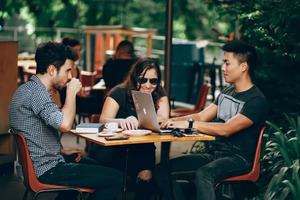 Photo by Helena Lopes: https://www.pexels.com/photo/group-of-friends-hanging-out-933964/ -- offsite team meeting, corporate events