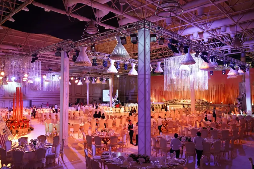 Photo by Denys Gromov: https://www.pexels.com/photo/people-standing-in-the-event-hall-4717550/ - corporate event venue