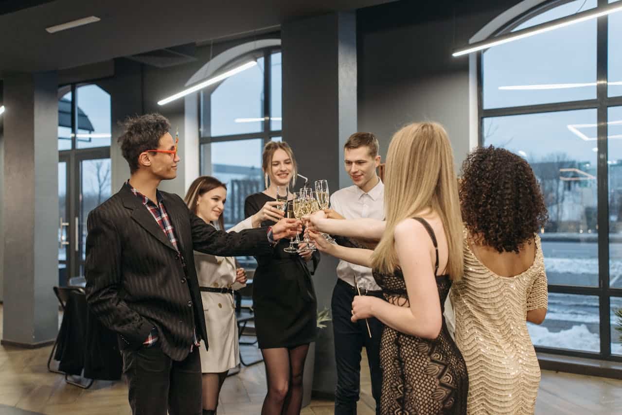 https://www.pexels.com/photo/group-of-men-and-women-doing-glass-toast-6405665/ - corporate event