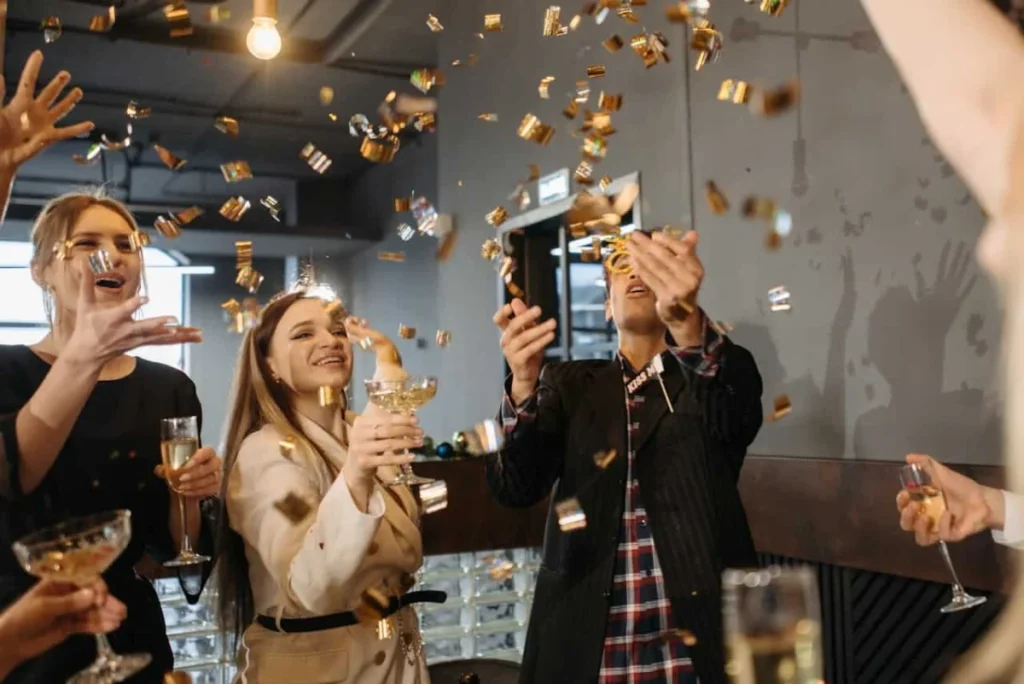 Image title: team-building event in NYC Image alt-title: A group of employees in a team building event. Image URL: https://www.pexels.com/photo/people-celebrating-new-year-6405773/ - team-building events