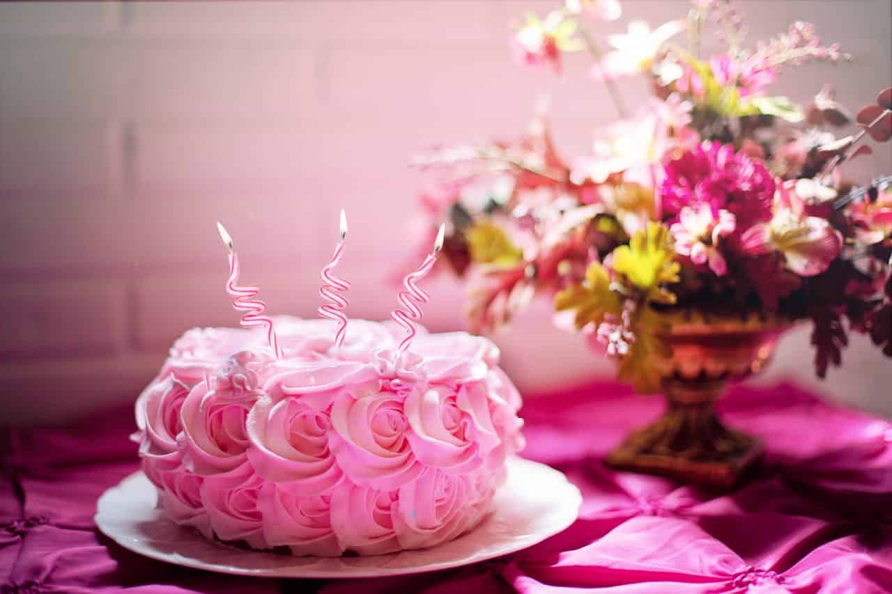 Photo by Jill Wellington: https://www.pexels.com/photo/pink-flower-cake-433527/ -- birthday party cake