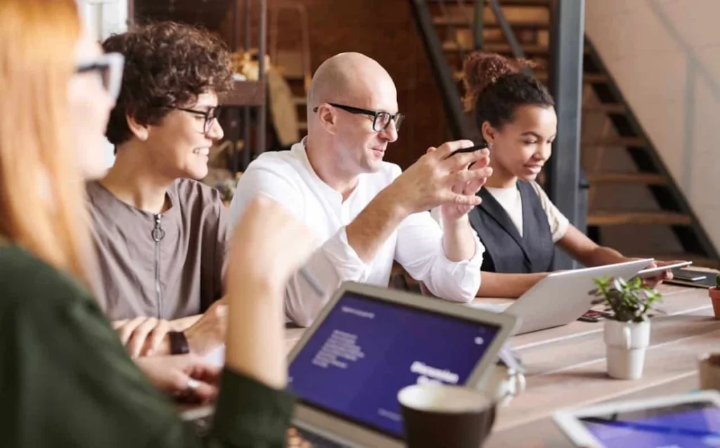 https://www.pexels.com/photo/photo-of-people-looking-on-laptop-3182801/ -- corporate event