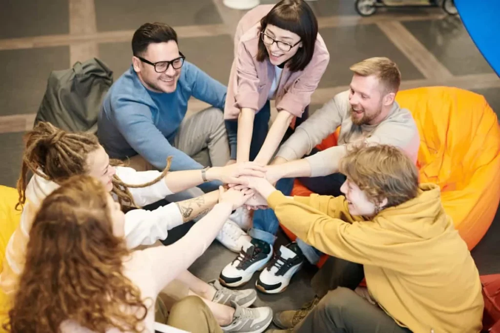 Photo by fauxels: https://www.pexels.com/photo/photo-of-people-holding-each-other-s-hands-3184421/ - team-building activities