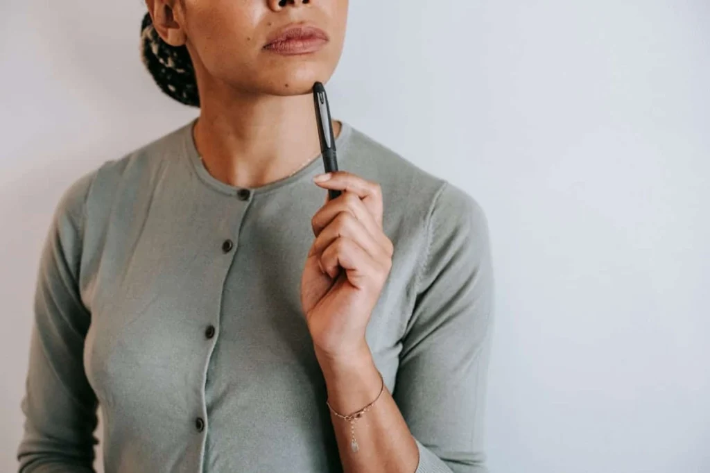 Photo by Alex Green: https://www.pexels.com/photo/pensive-woman-standing-with-pen-in-light-room-5699498/ - choose an event planner