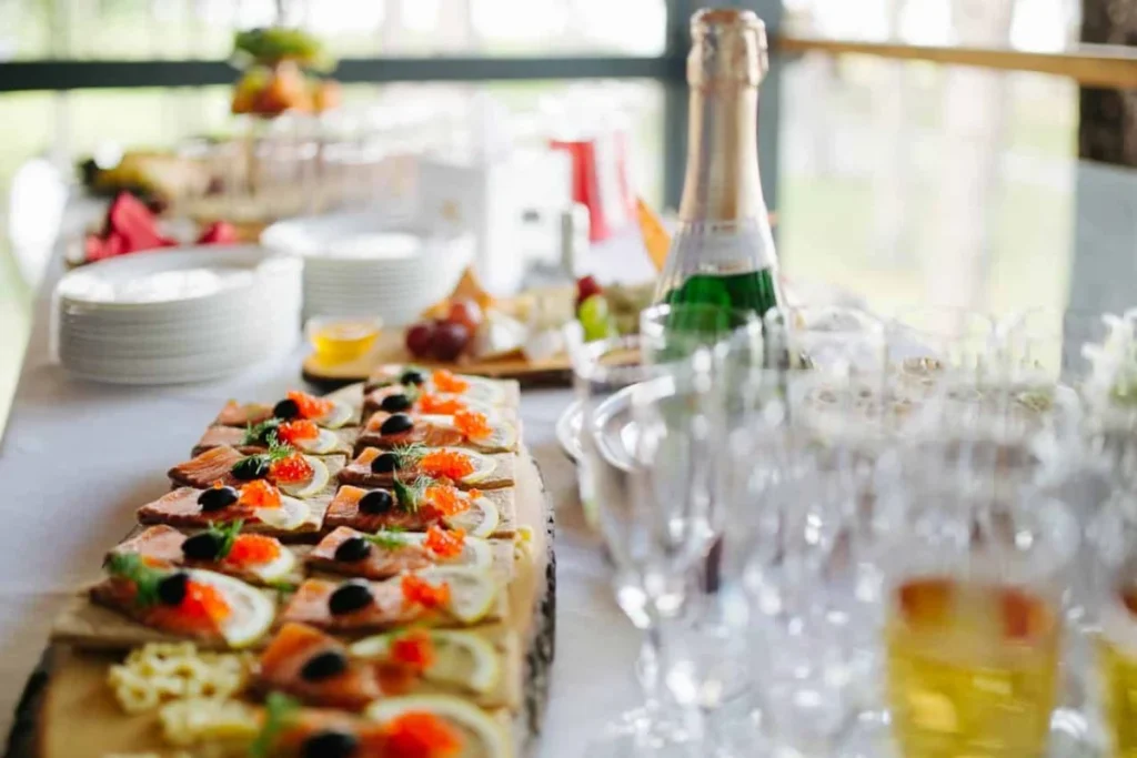 https://www.pexels.com/photo/catering-appetizers-on-wooden-board-next-to-empty-champagne-glasses-11066891/ -- catering