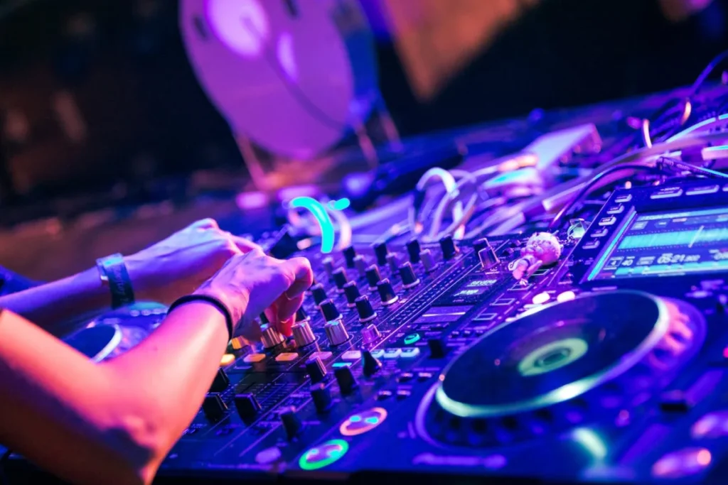 Photo by Gigxels com: https://www.pexels.com/photo/person-turning-knobs-on-dj-digital-mixer-deck-8131392/ -- corporate event dj, entertainment