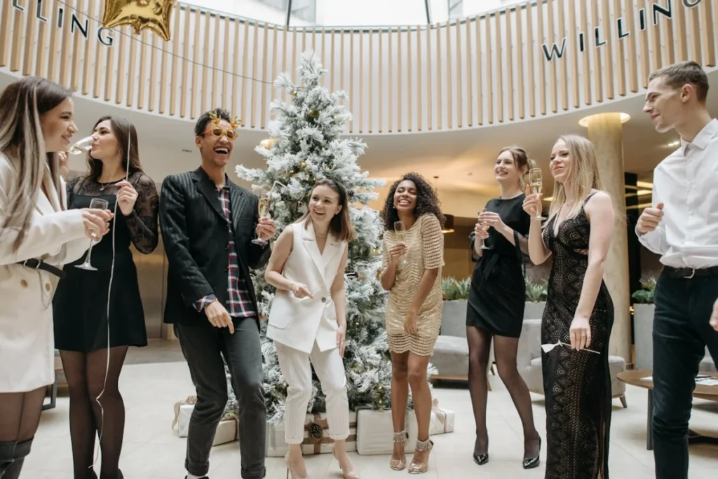 Photo by Pavel Danilyuk: https://www.pexels.com/photo/group-of-people-drinking-wine-6405800/ - holiday party