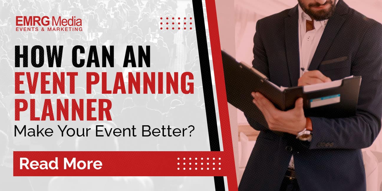 A feature image for EMRG Media with the question "HOW CAN AN EVENT PLANNING PLANNER Make Your Event Better?" On the right, a man in a dark suit, wearing a watch, is holding an open clipboard or folder and writing. The left side displays a blurred image of a crowd, indicating an event setting. A red "Read More" button is also visible.