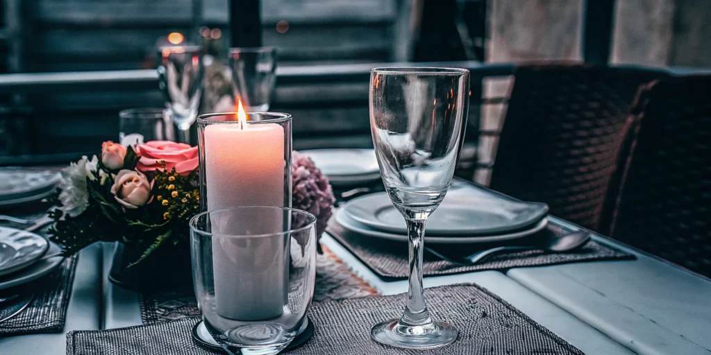 Elegant candlelit dinner table set for a client appreciation event.