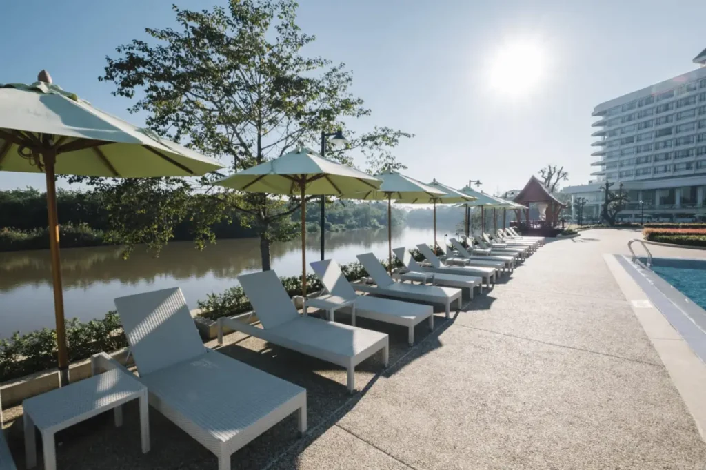 deckchair and swimming pool in hotel