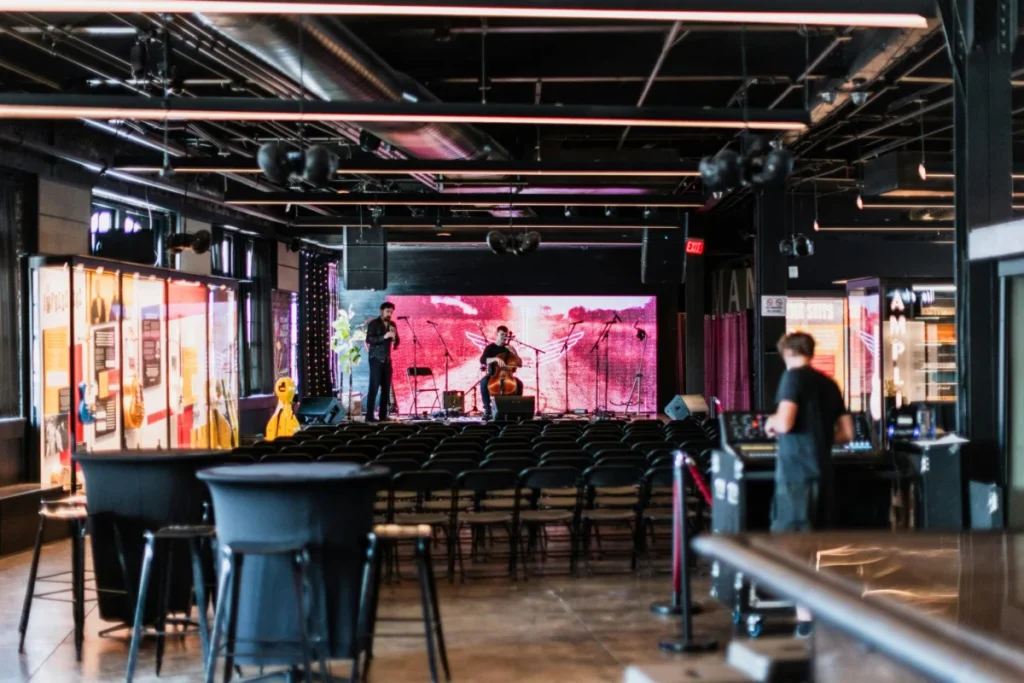 Photo by Kelly : https://www.pexels.com/photo/musicians-preparing-for-concert-17513729/
