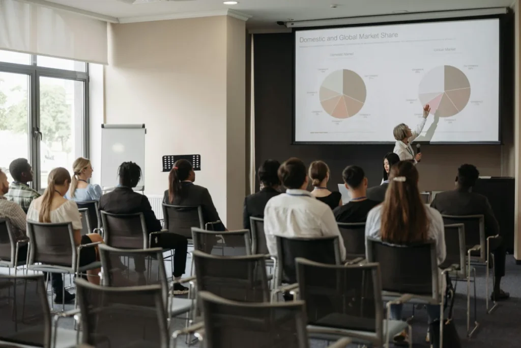Photo by Pavel Danilyuk: https://www.pexels.com/photo/people-sitting-in-front-of-the-projector-screen-8761523/