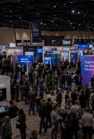 Attendees networking at a large conference and expo organized by EMRG Media in New York City.