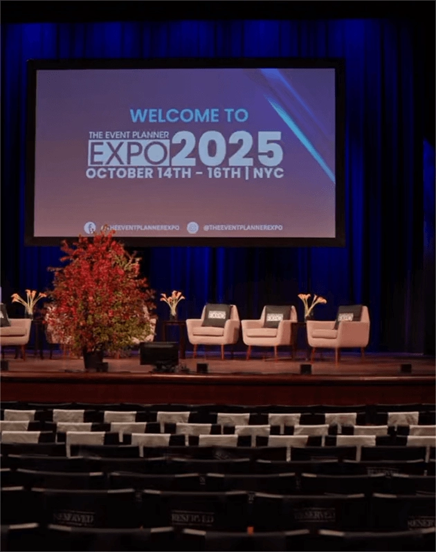 Stage setup for The Event Planner Expo in New York City featuring branded presentation screens and panel seating.