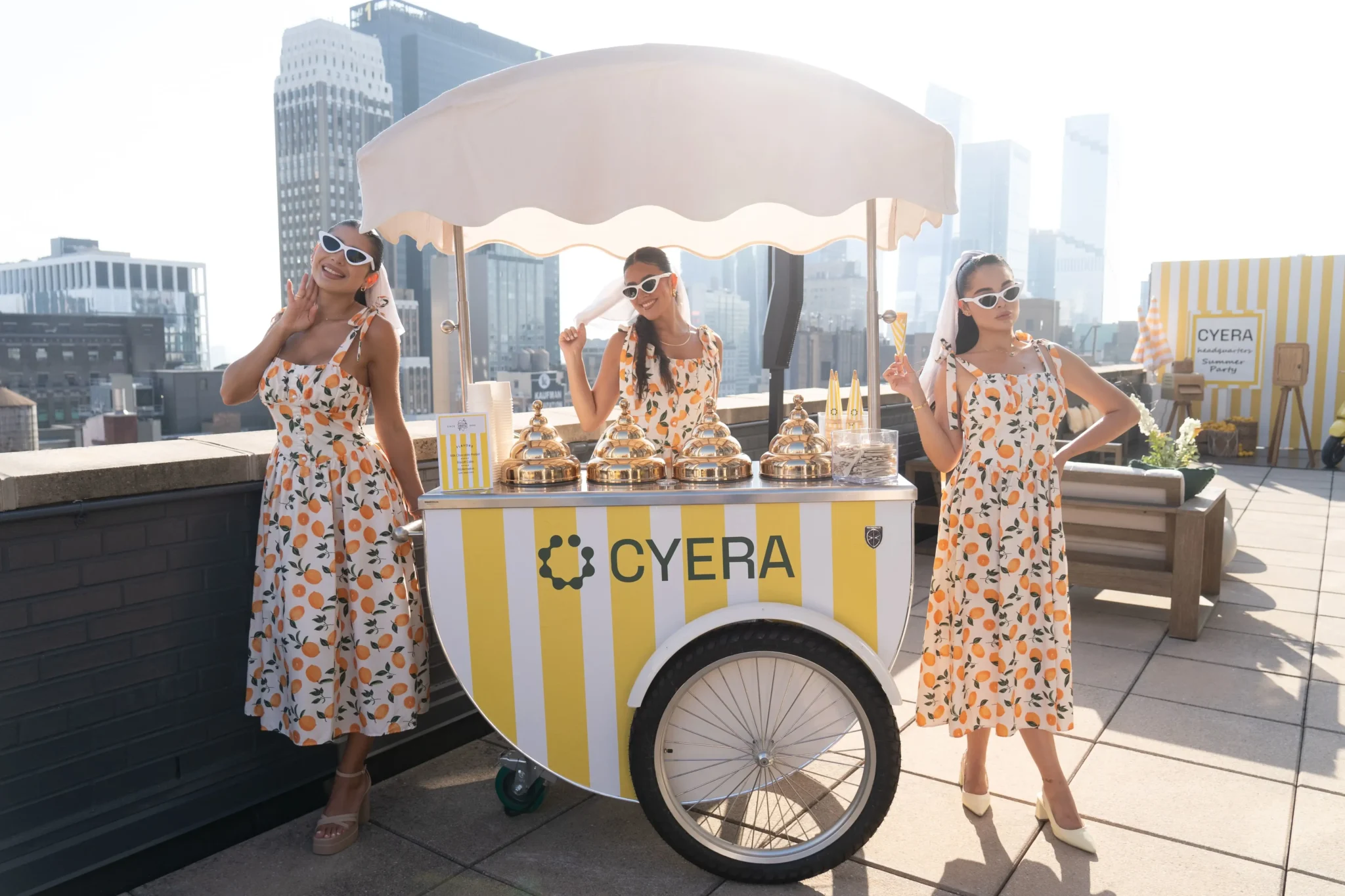 Cyera branded gelato cart with staff on a NYC rooftop against the skyline, EMRG Media