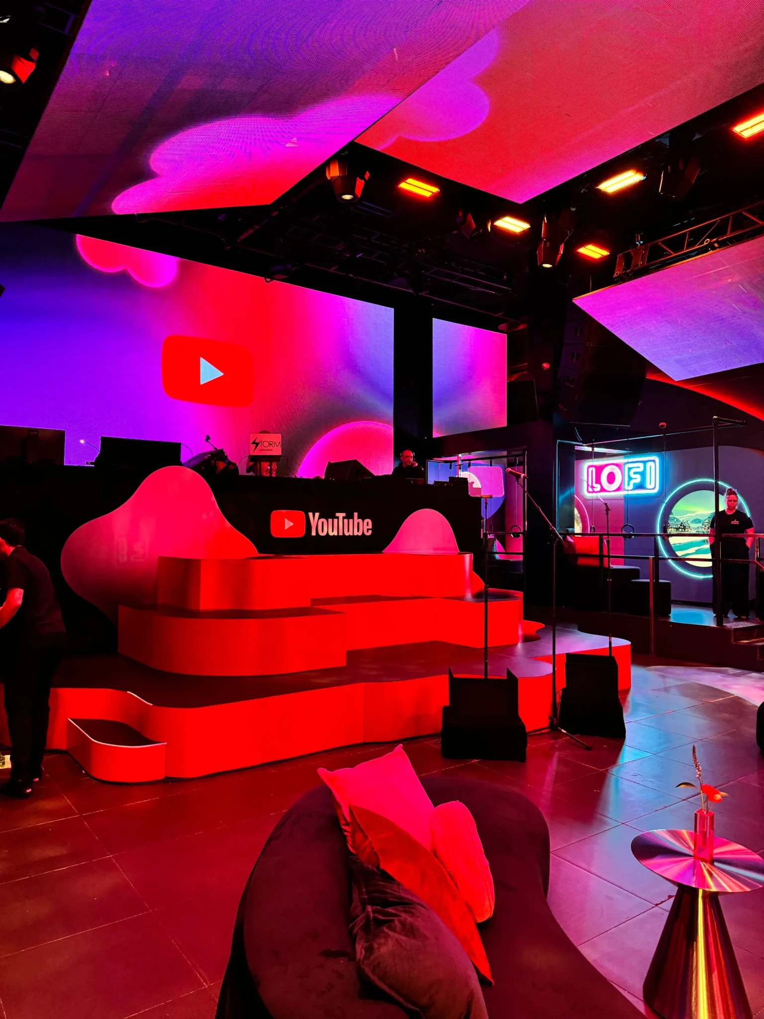 Sculptural YouTube branded stage set in red lighting with a LOFI neon sign, NYC event by EMRG Media