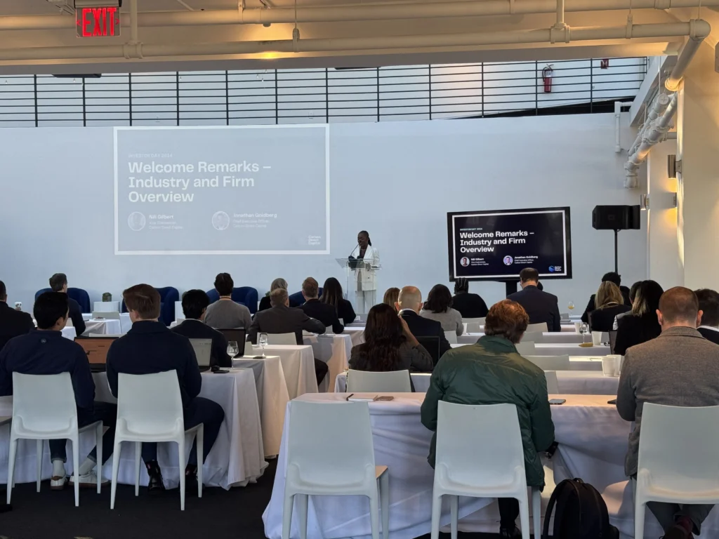 Speaker delivering welcome remarks at an industry conference in NYC, event photography by EMRG Media