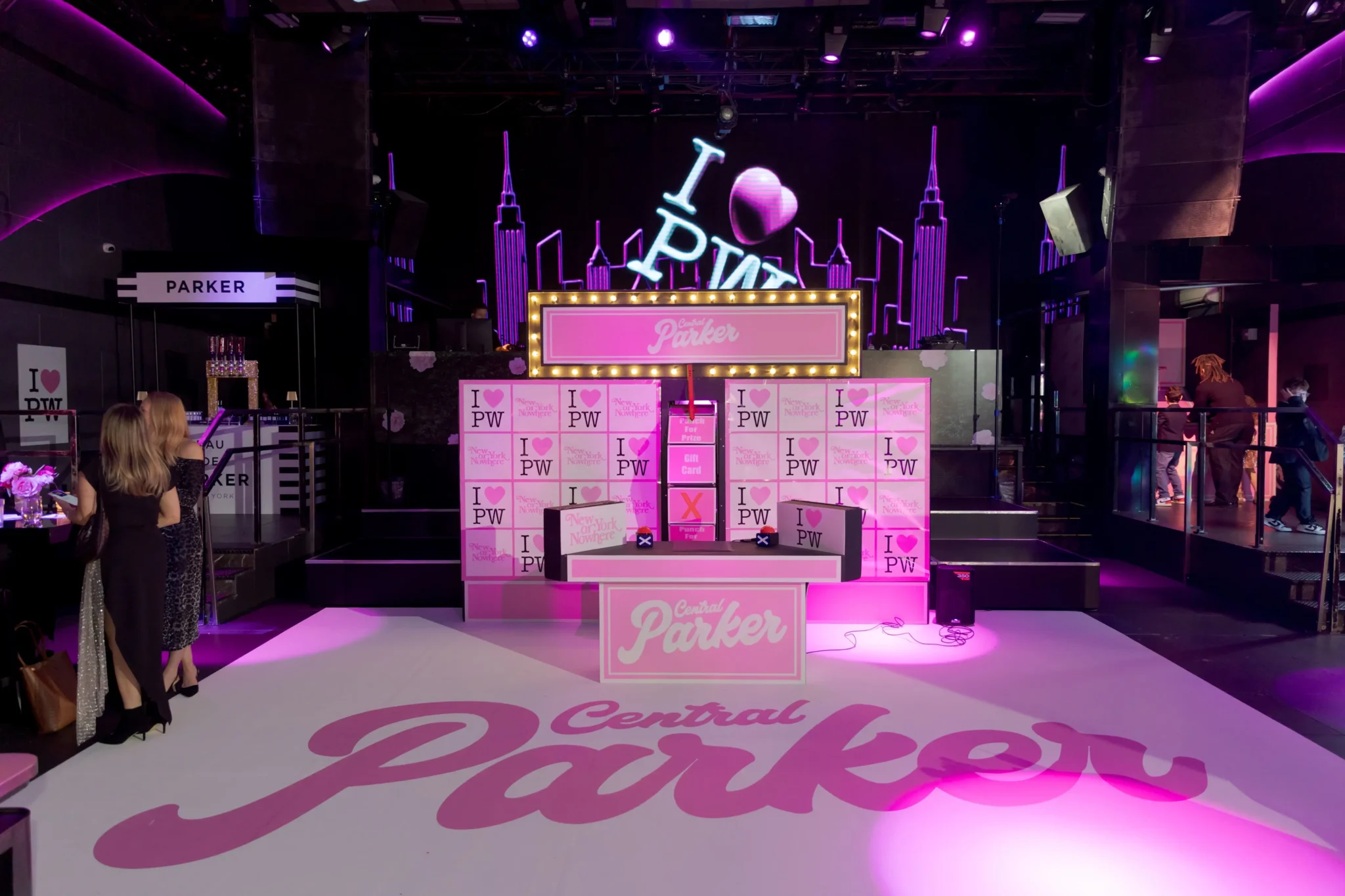 "Central Parker" branded step-and-repeat backdrop with marquee lighting and NYC skyline accents by EMRG Media