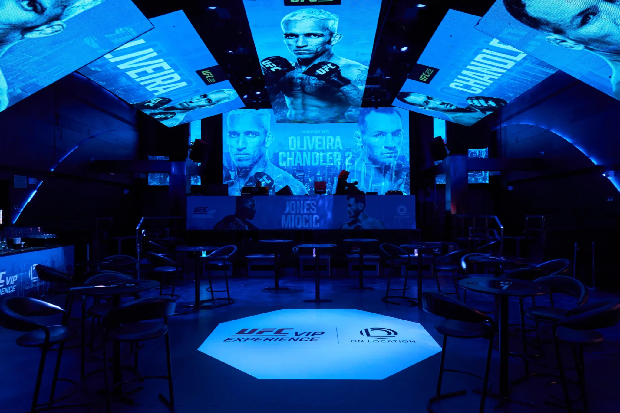 UFC VIP Experience lounge with fighter graphics on LED screens, live event production by EMRG Media